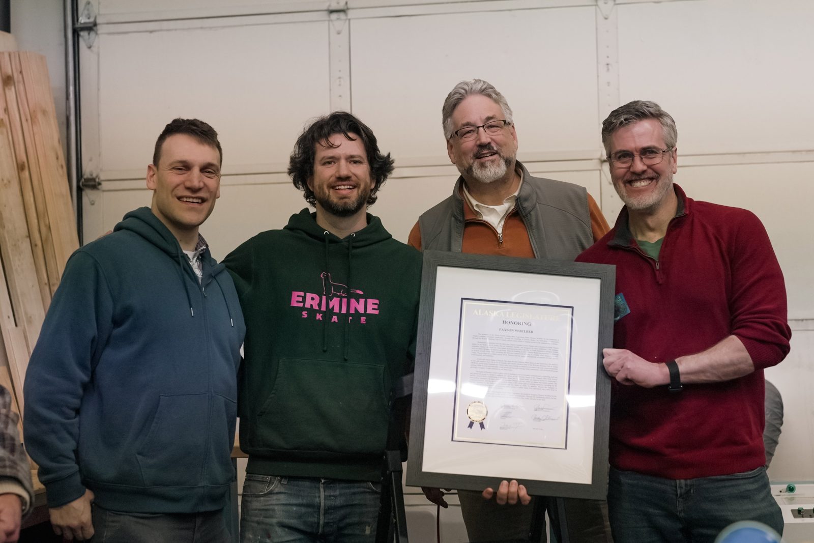Paxson Woelber receiving a legislative citation at the Ermine storefront grand opening